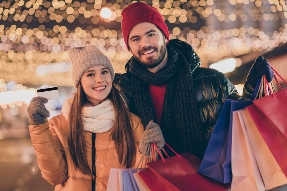 Photo of Two People Students Friends Hold Shopping Bags Credit Card Under X-mas Christmas Outdoors Evening Lights