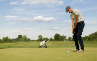 Young man playing golf